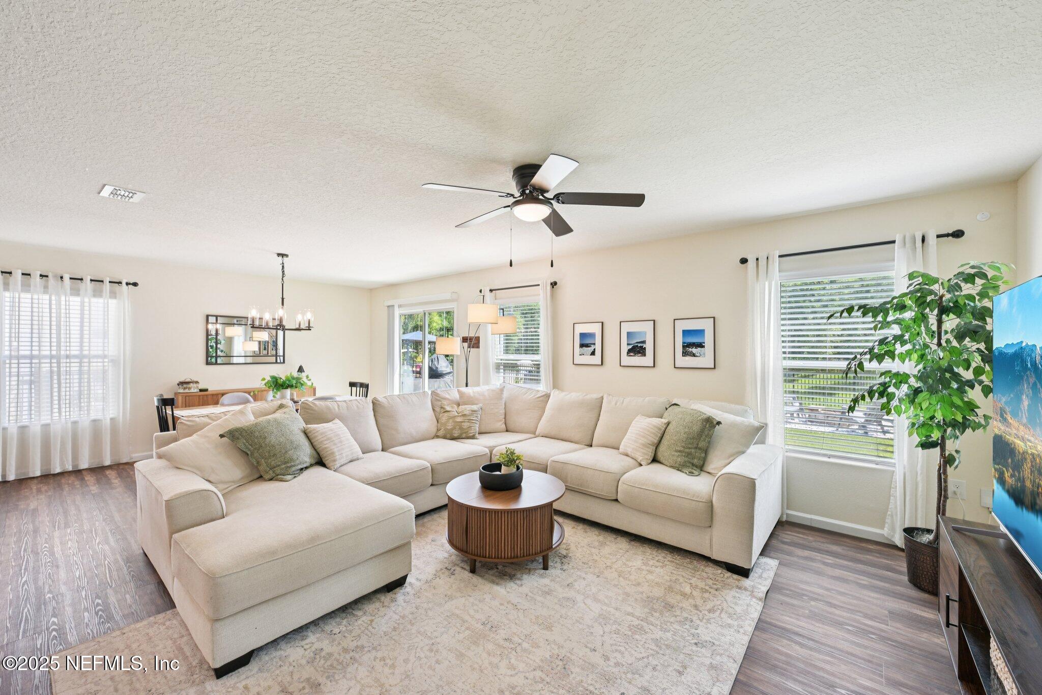 1143 Morgans Treasure Road St. Augustine, FL 32084 - Photo 6 of 39 a living room with furniture and a large window