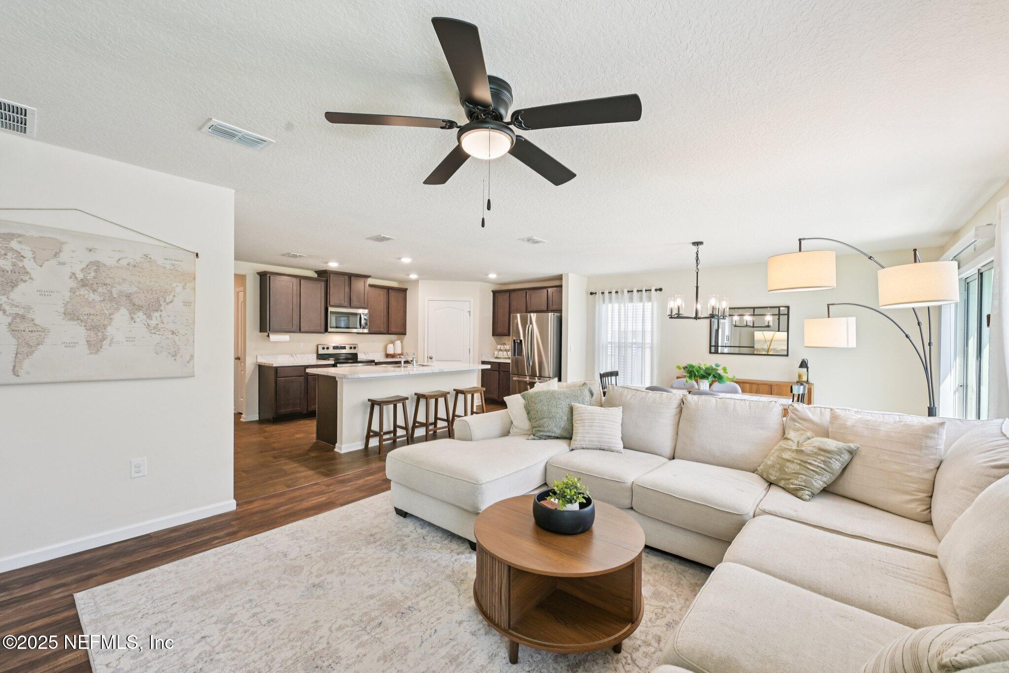 1143 Morgans Treasure Road St. Augustine, FL 32084 - Photo 7 of 39 a living room with furniture and a large window