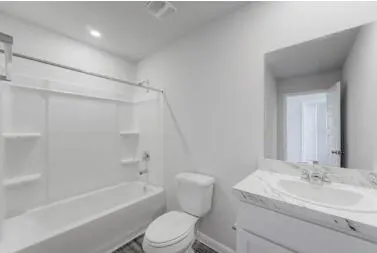 a bathroom with a sink a toilet and a bathtub