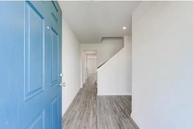 529 Don Lane Itasca, TX 76055 - Photo 14 of 15 a view of a hallway with wooden floor