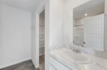 a bathroom with a bathtub and a sink