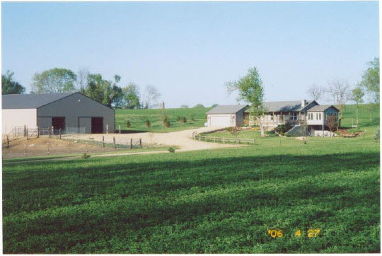 402 South Bolen Road Pecatonica, IL 61063 - Photo 2 of 6 a backyard of a house with table and chairs