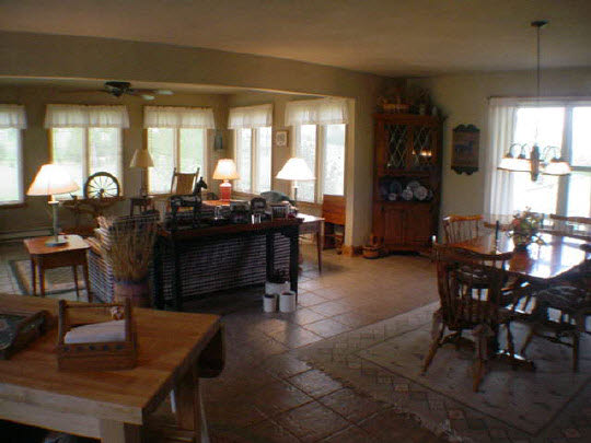 402 South Bolen Road Pecatonica, IL 61063 - Photo 4 of 6 a living room with furniture a window and a table