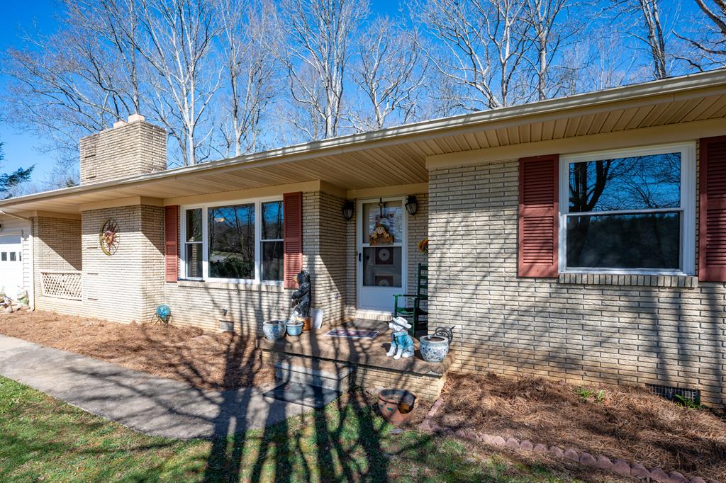 1550 Highway 2 Blue Ridge, GA 30513 - Photo 3 of 46 a front view of a house with a patio