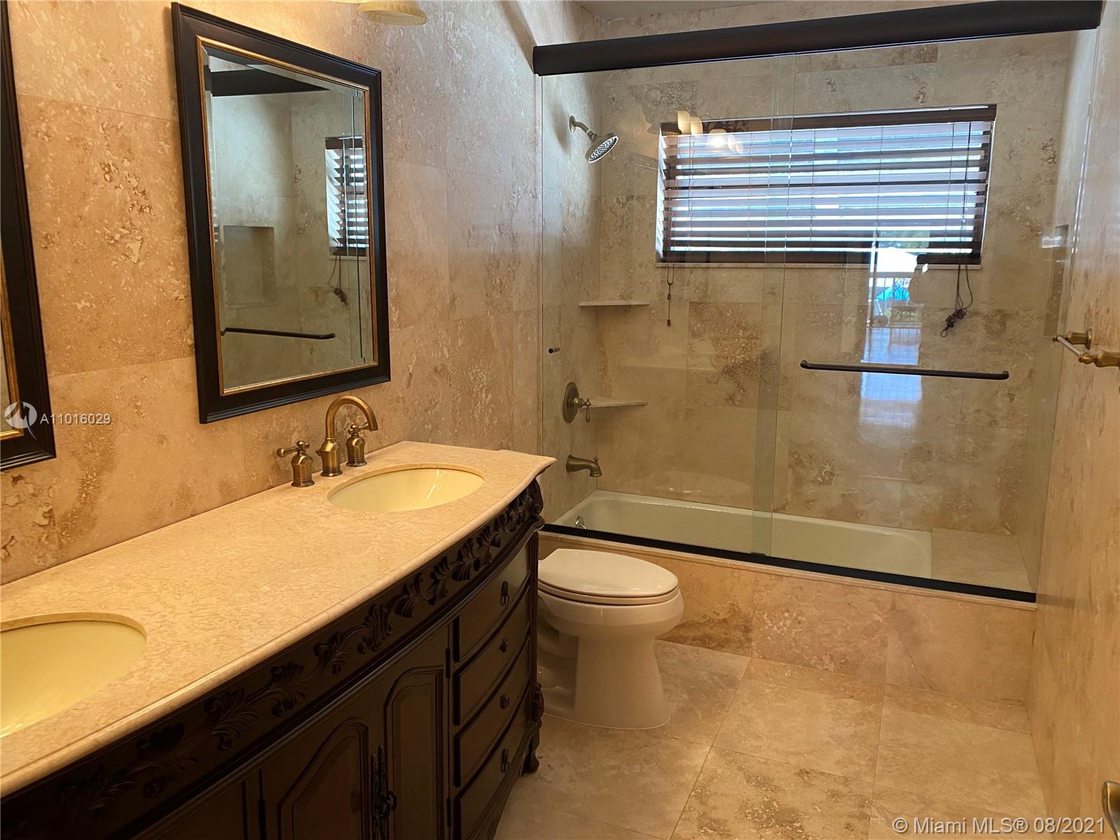 5278 Boca Marina Circle South Boca Raton, FL 33487 - Photo 19 of 37 a bathroom with a sink and a mirror