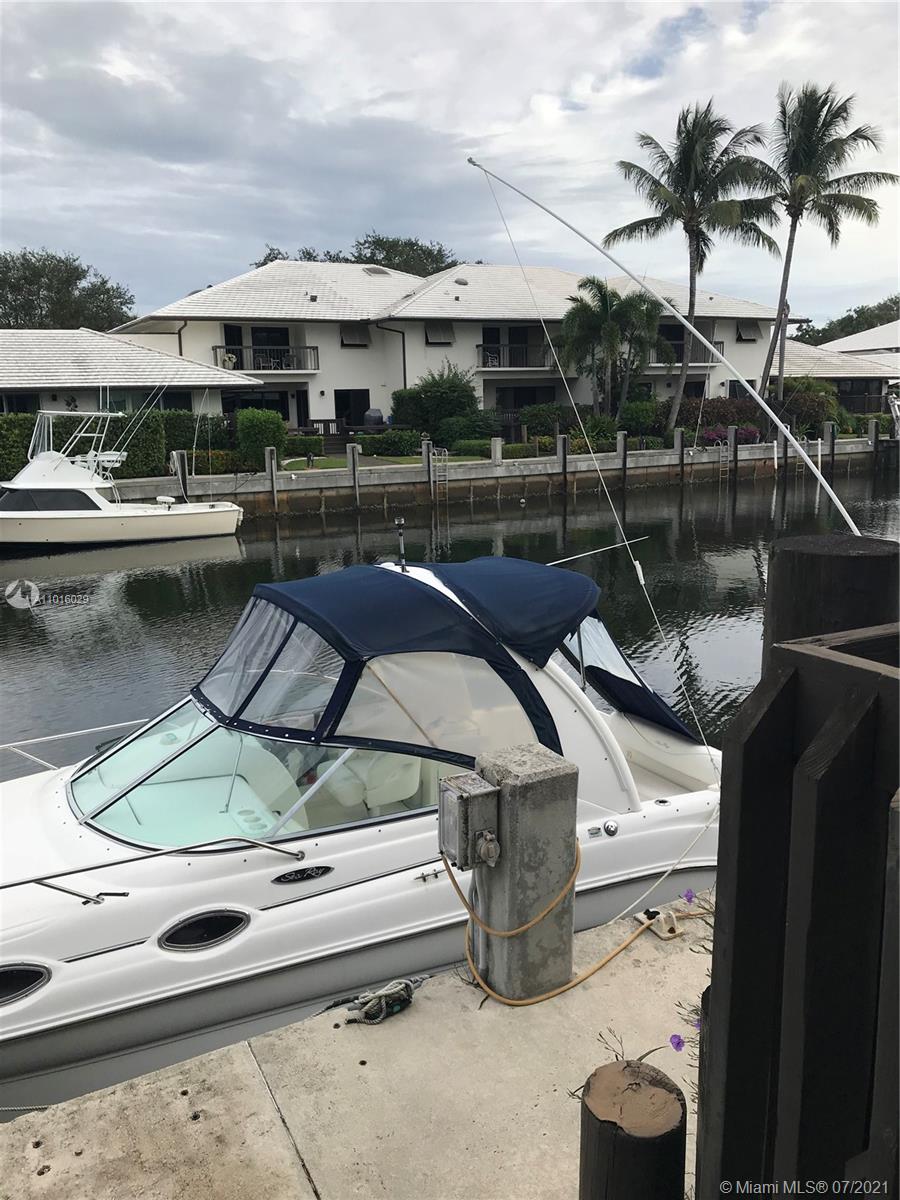 5278 Boca Marina Circle South Boca Raton, FL 33487 - Photo 28 of 37 a roof deck with table and chairs a barbeque