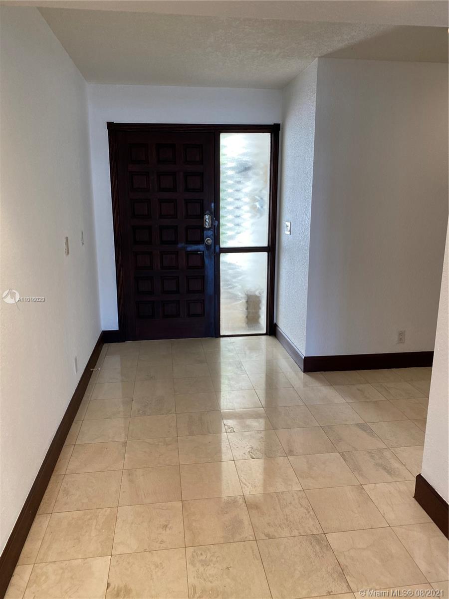 5278 Boca Marina Circle South Boca Raton, FL 33487 - Photo 5 of 37 a view of entryway with a window and a fireplace