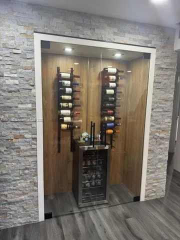 a kitchen with stainless steel appliances granite countertop a sink and cabinets