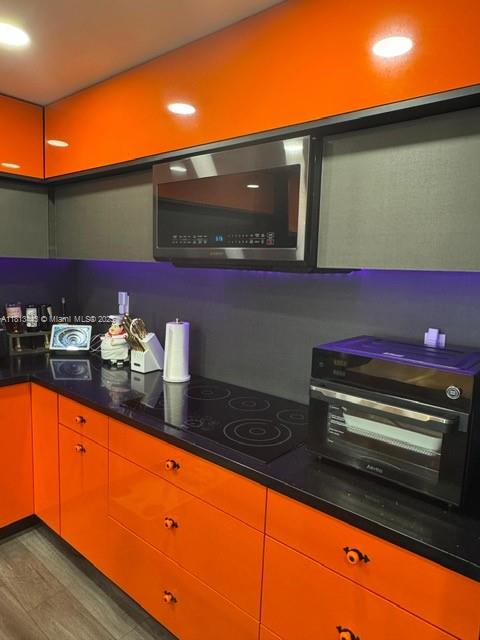 4550 Northwest 9th Street, Unit 520E Miami, FL 33126 - Photo 3 of 19 a kitchen with stainless steel appliances granite countertop a sink and cabinets