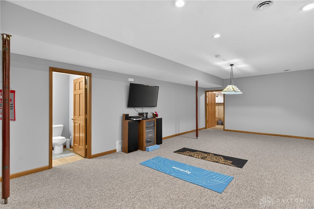 5264 Frazier-Guy Road Sidney, OH 45365 - Photo 36 of 51 This versatile basement space offers a comfortable area for recreation and includes convenient access to a bathroom.