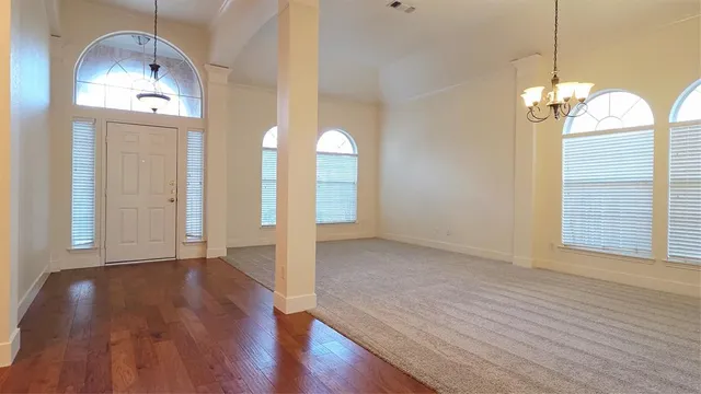 a view of a livingroom with wooden floor
