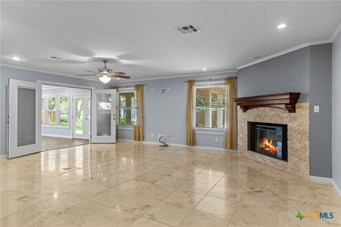 3745-3735 Canyon Heights Road Belton, TX 76513 - Photo 12 of 45 a view of an empty room with window and fire place