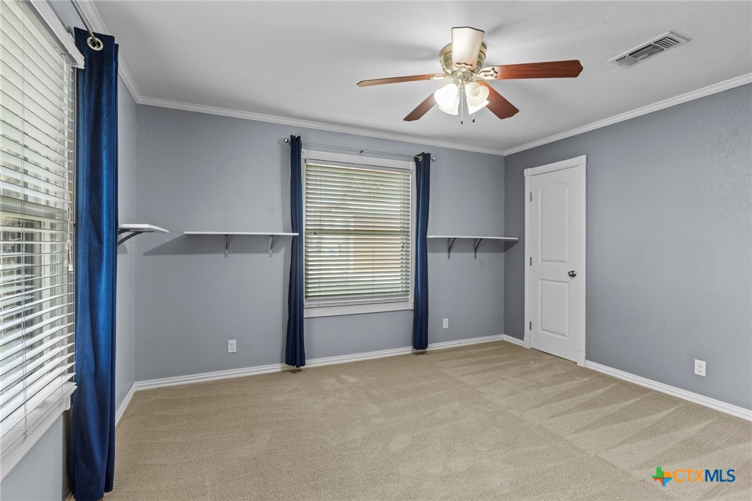 3745-3735 Canyon Heights Road Belton, TX 76513 - Photo 34 of 45 a view of empty room with window and ceiling fan