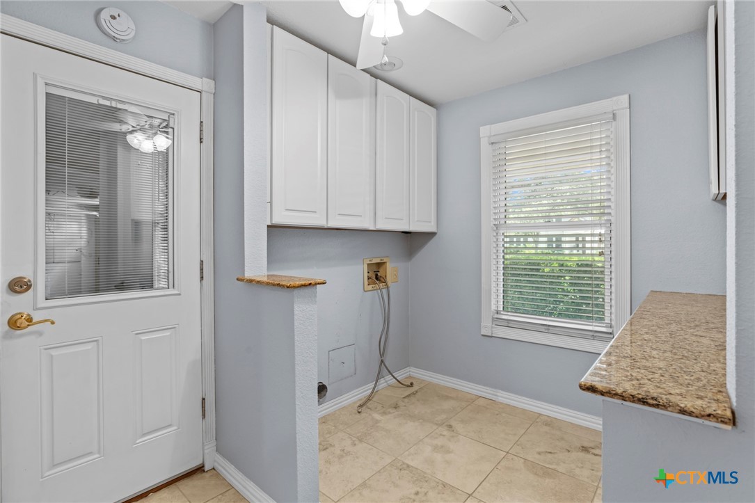 3745-3735 Canyon Heights Road Belton, TX 76513 - Photo 37 of 45 a view of an entryway with wooden floor and cabinet
