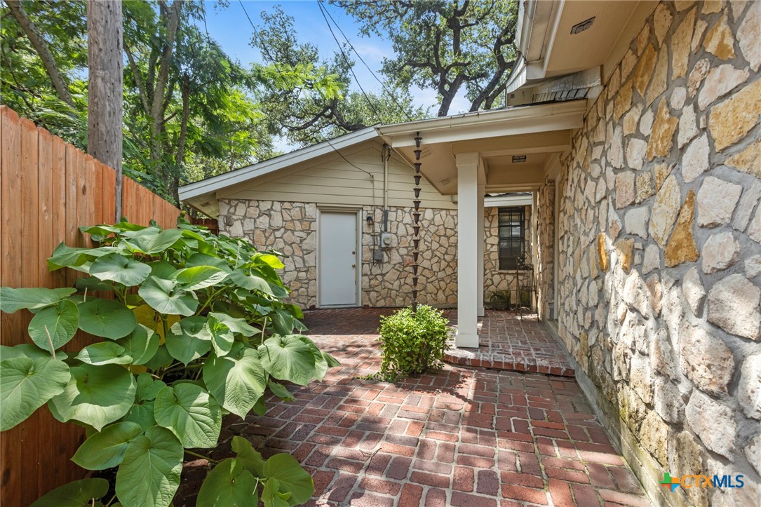 3745-3735 Canyon Heights Road Belton, TX 76513 - Photo 43 of 45 a white house with a flower garden