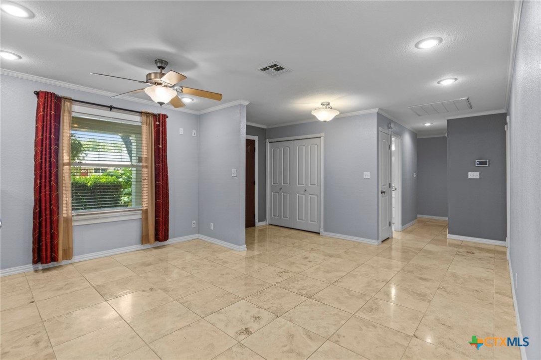 3745-3735 Canyon Heights Road Belton, TX 76513 - Photo 9 of 45 a view of an empty room with a chandelier