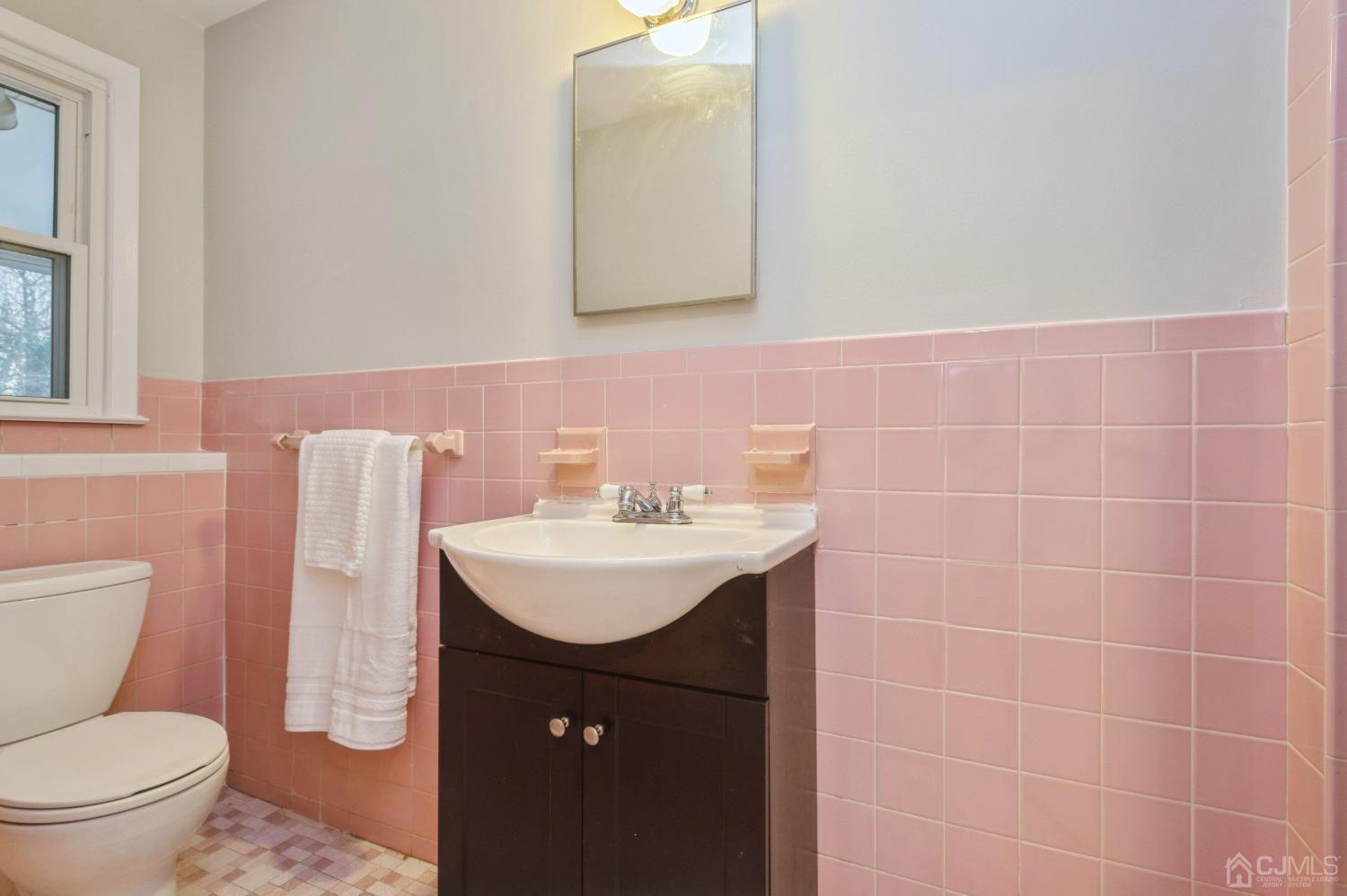 1 Bruce Road East Brunswick, NJ 08816 - Photo 11 of 21 a bathroom with a sink toilet and mirror