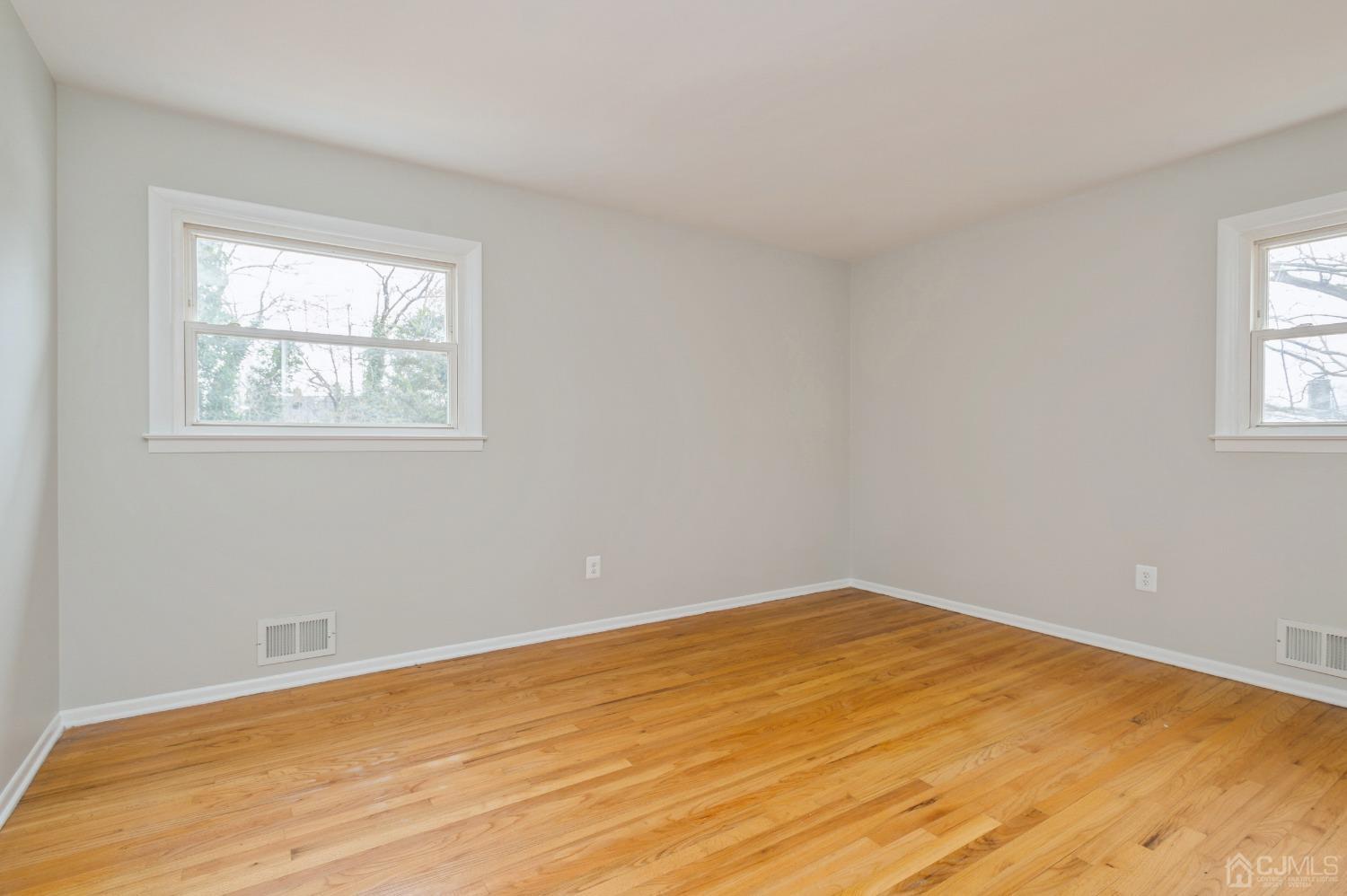 1 Bruce Road East Brunswick, NJ 08816 - Photo 14 of 21 a view of empty room with wooden floor