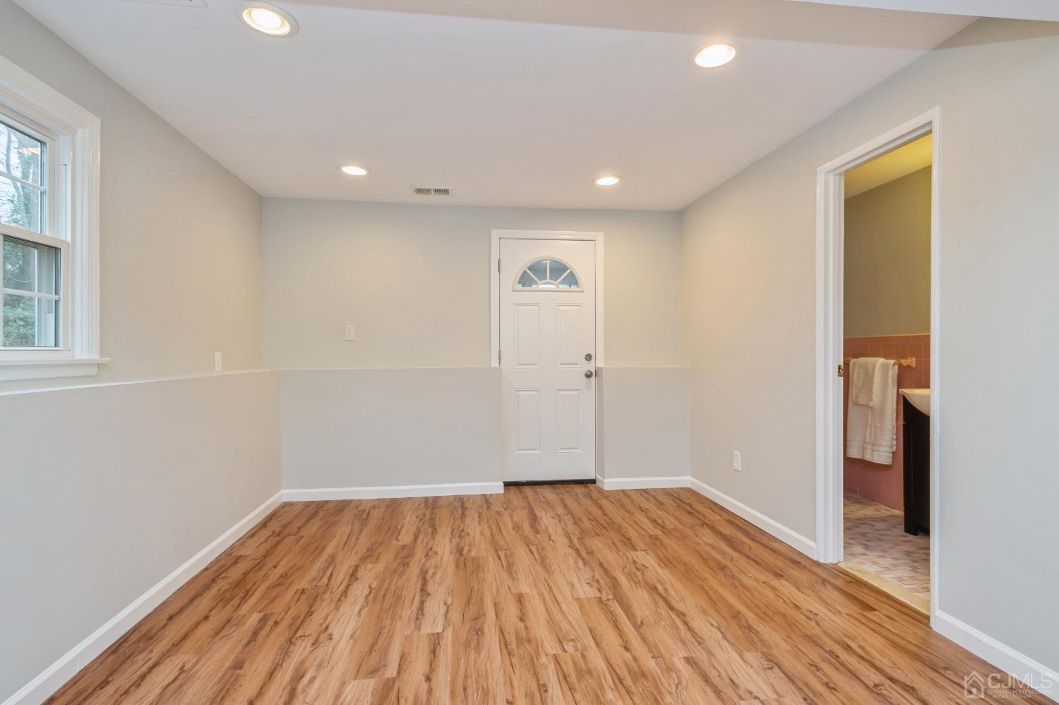 1 Bruce Road East Brunswick, NJ 08816 - Photo 15 of 21 a view of a room with wooden floor and a ceiling fan