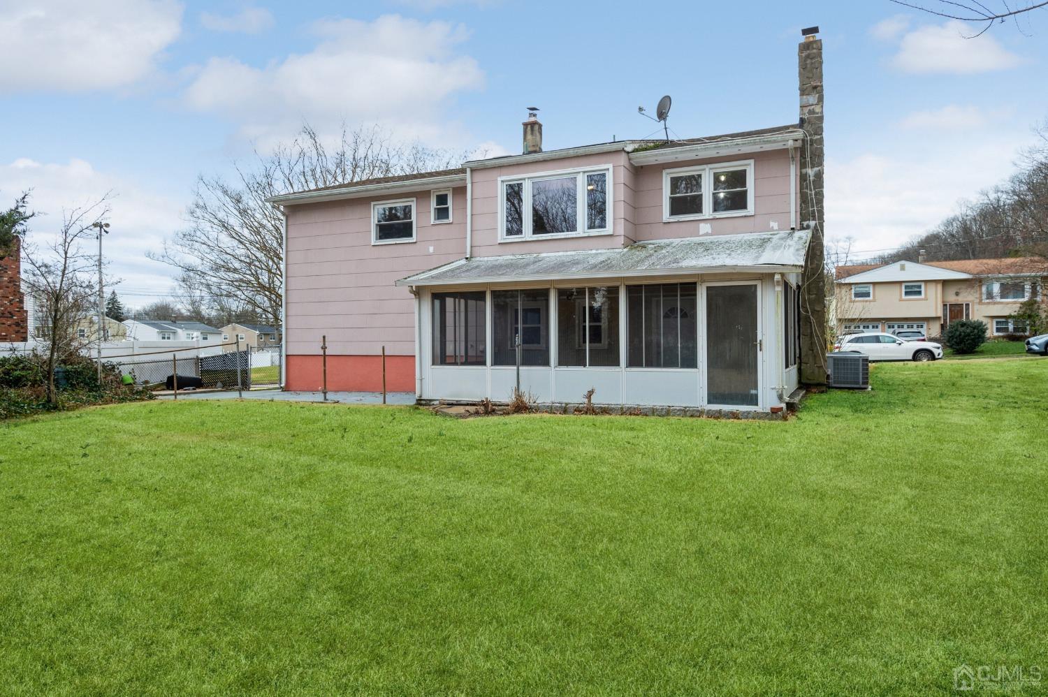 1 Bruce Road East Brunswick, NJ 08816 - Photo 21 of 21 a view of a house with a backyard
