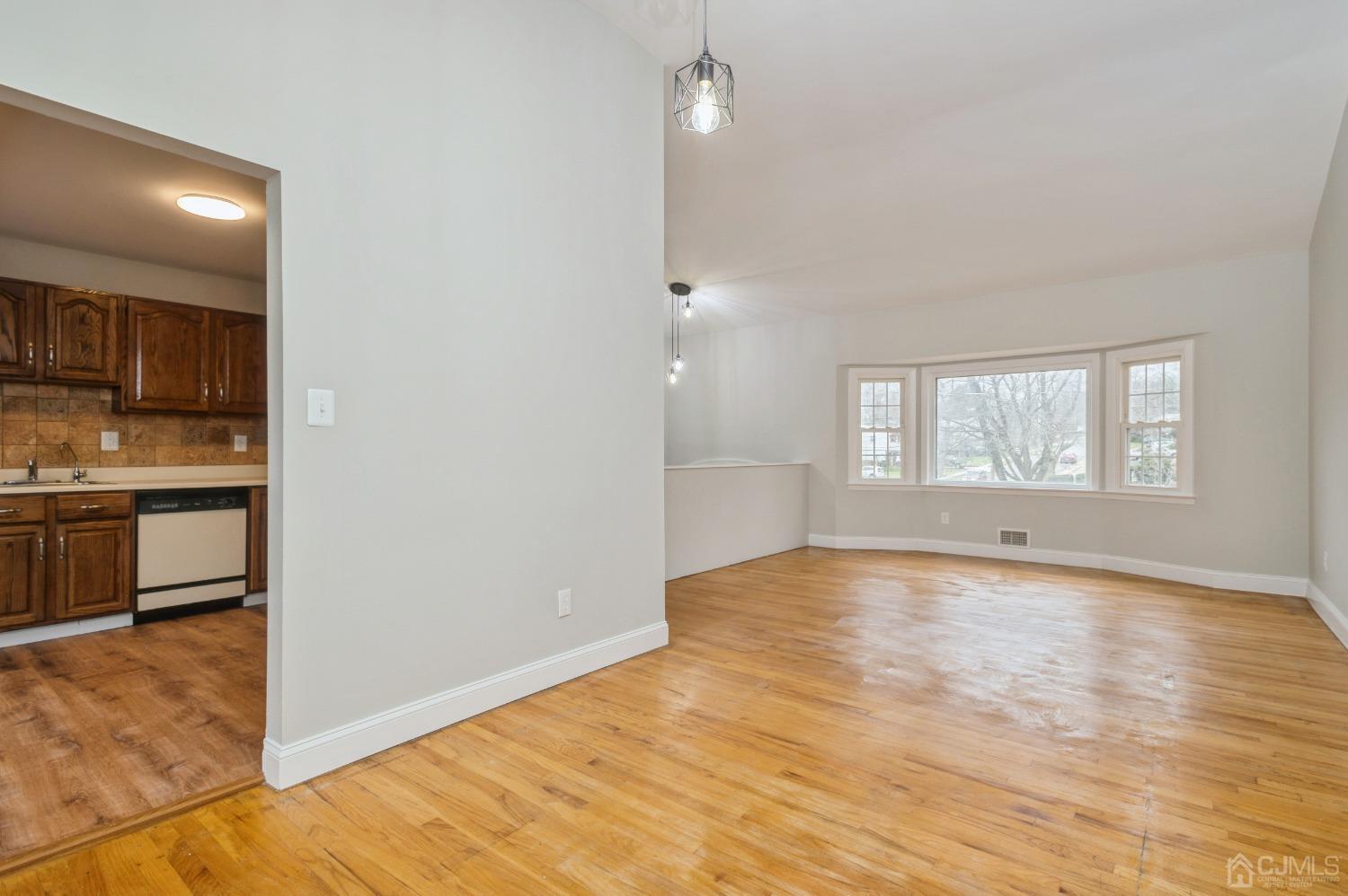 1 Bruce Road East Brunswick, NJ 08816 - Photo 5 of 21 a view of an empty room with window and wooden floor