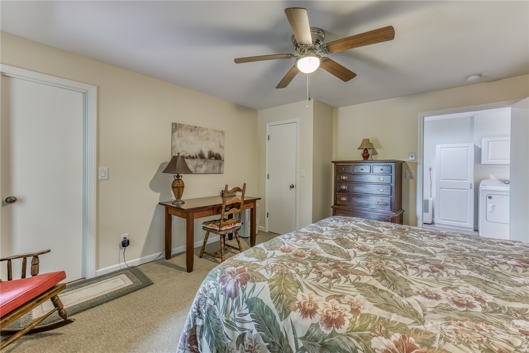 174 Spruce Pine Road Newland, NC 28657 - Photo 26 of 50 a bedroom with a bed and a chandelier