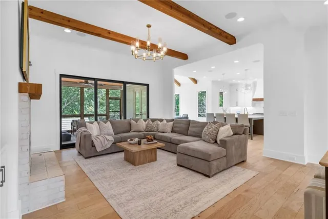 a white bath tub sitting next to a shower