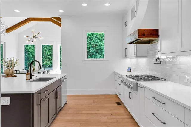a bathroom with a sink mirror and toilet