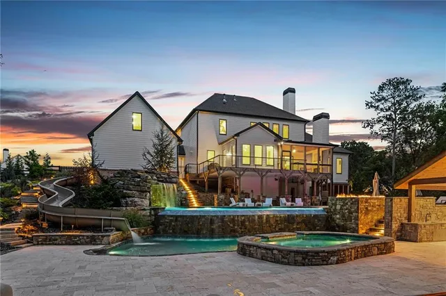 an aerial view of a house with outdoor space