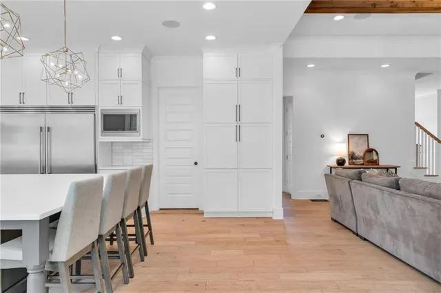 a view of a field of grass and trees