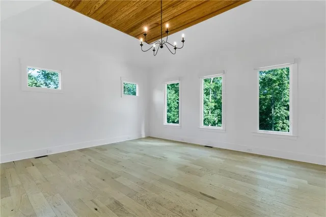 a view of patio with a table and chairs under an umbrella