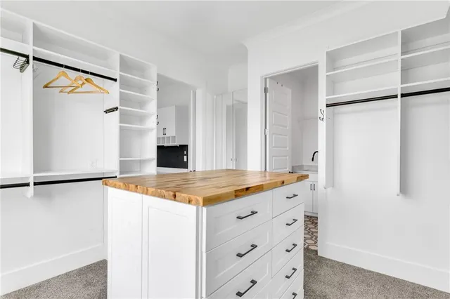a front view of a house with a garden and porch
