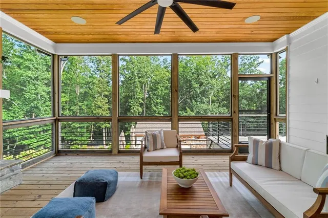 a front view of a house with swimming pool and yard