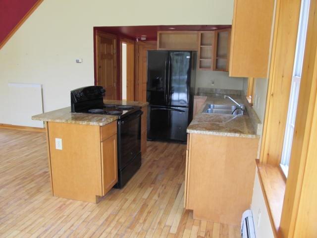 Kitchen area with granite counters
