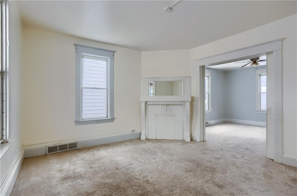 403 Federal Street Butler, PA 16001 - Photo 11 of 46 The family room features a corner deco fireplace.