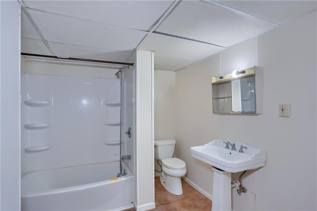 403 Federal Street Butler, PA 16001 - Photo 27 of 46 The shared hall bathroom has a tub/shower combo.