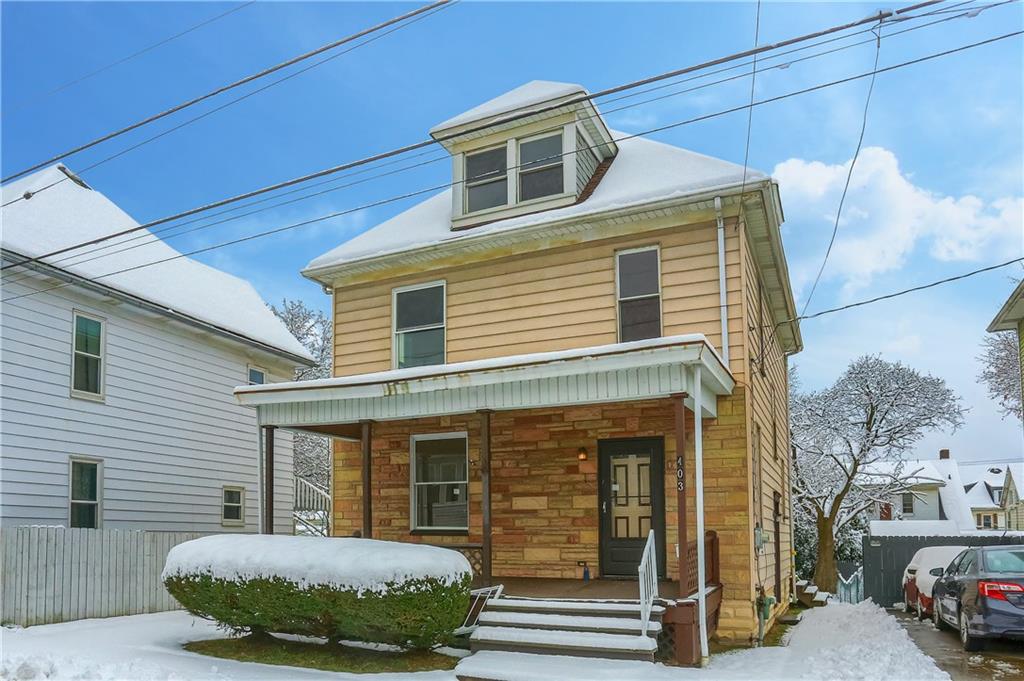 A large front porch greets guests to this home.
