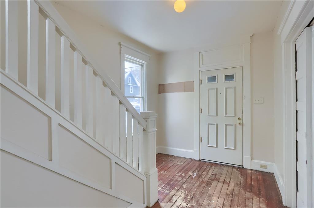 Wooden detailing graces the charming entryway.