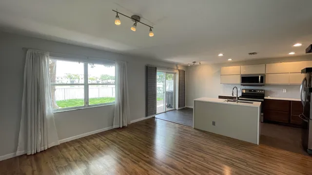 a view of a storage and utility room with a sink