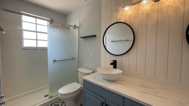 a bathroom with a sink and mirror
