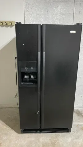 a kitchen with a refrigerator stove and microwave