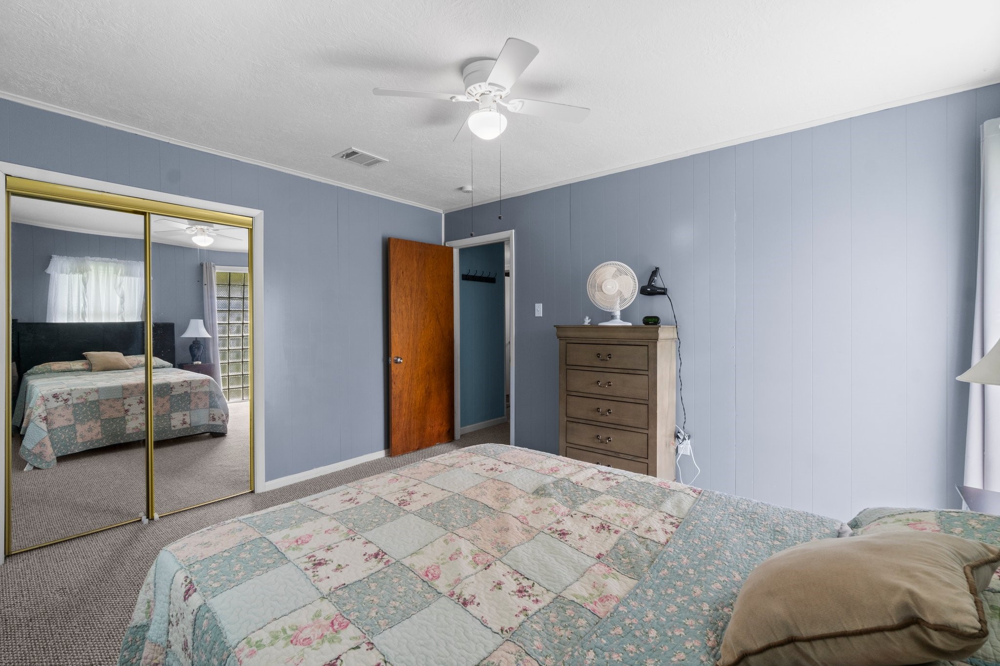 21 Clearview Point Blank, TX 77364 - Photo 25 of 43 a bedroom with a bed and a dresser