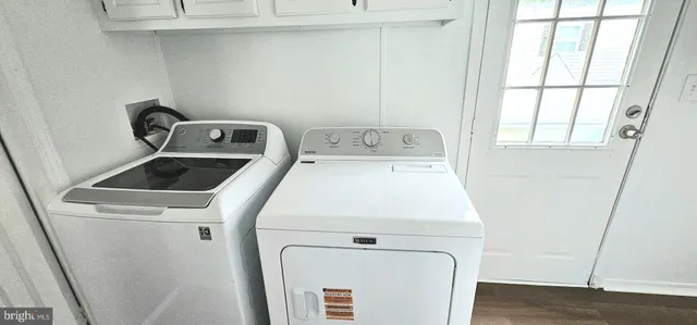 a utility room with dryer and washer