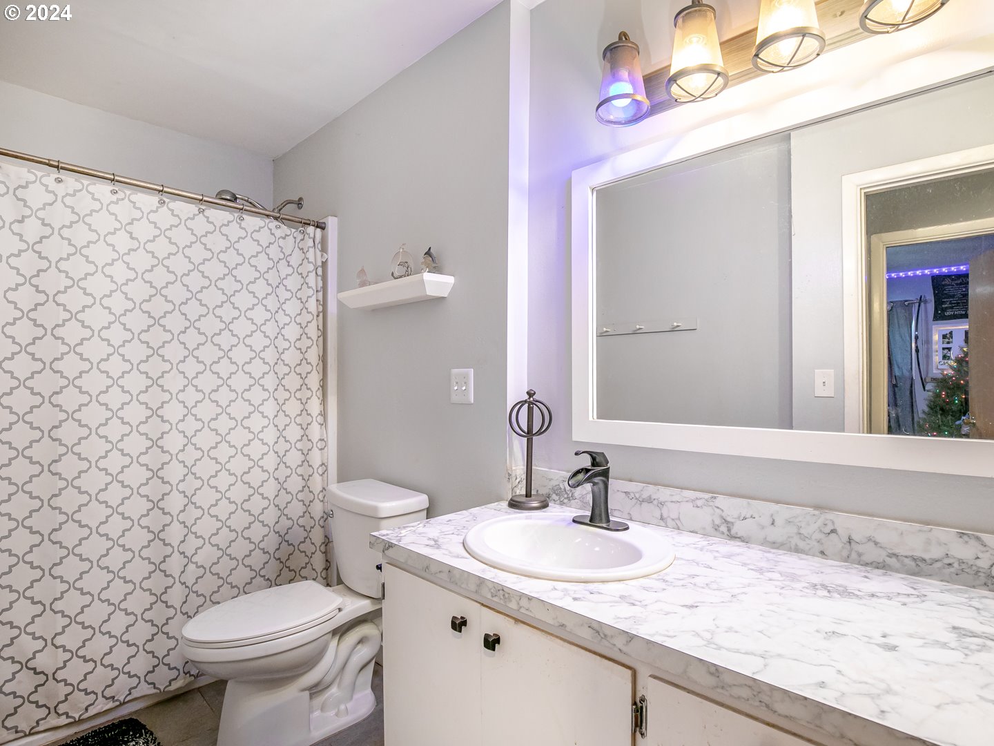 24502 South Springwater Road Estacada, OR 97023 - Photo 24 of 48 a bathroom with a granite countertop sink toilet and a mirror