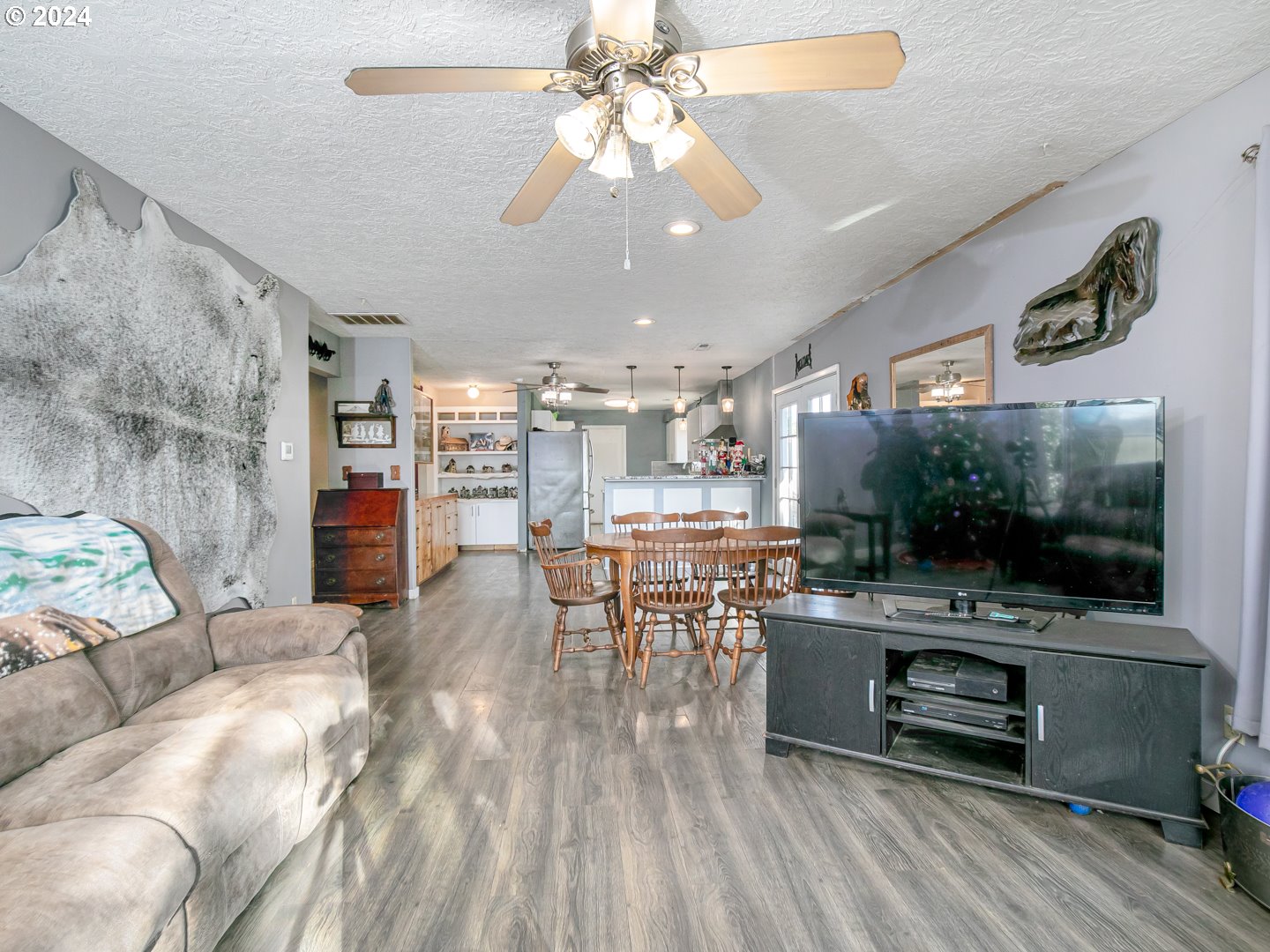 24502 South Springwater Road Estacada, OR 97023 - Photo 6 of 48 a living room with furniture and a flat screen tv