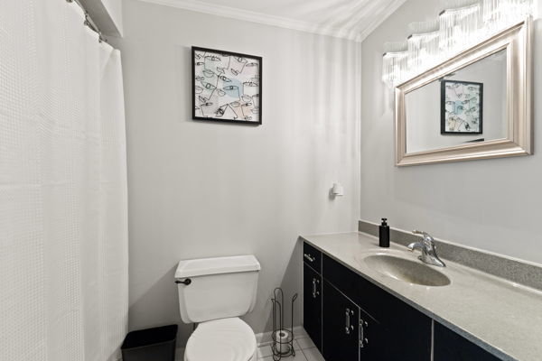 24222 Volbrecht Road Crete, IL 60417 - Photo 13 of 16 a bathroom with a toilet a sink and mirror
