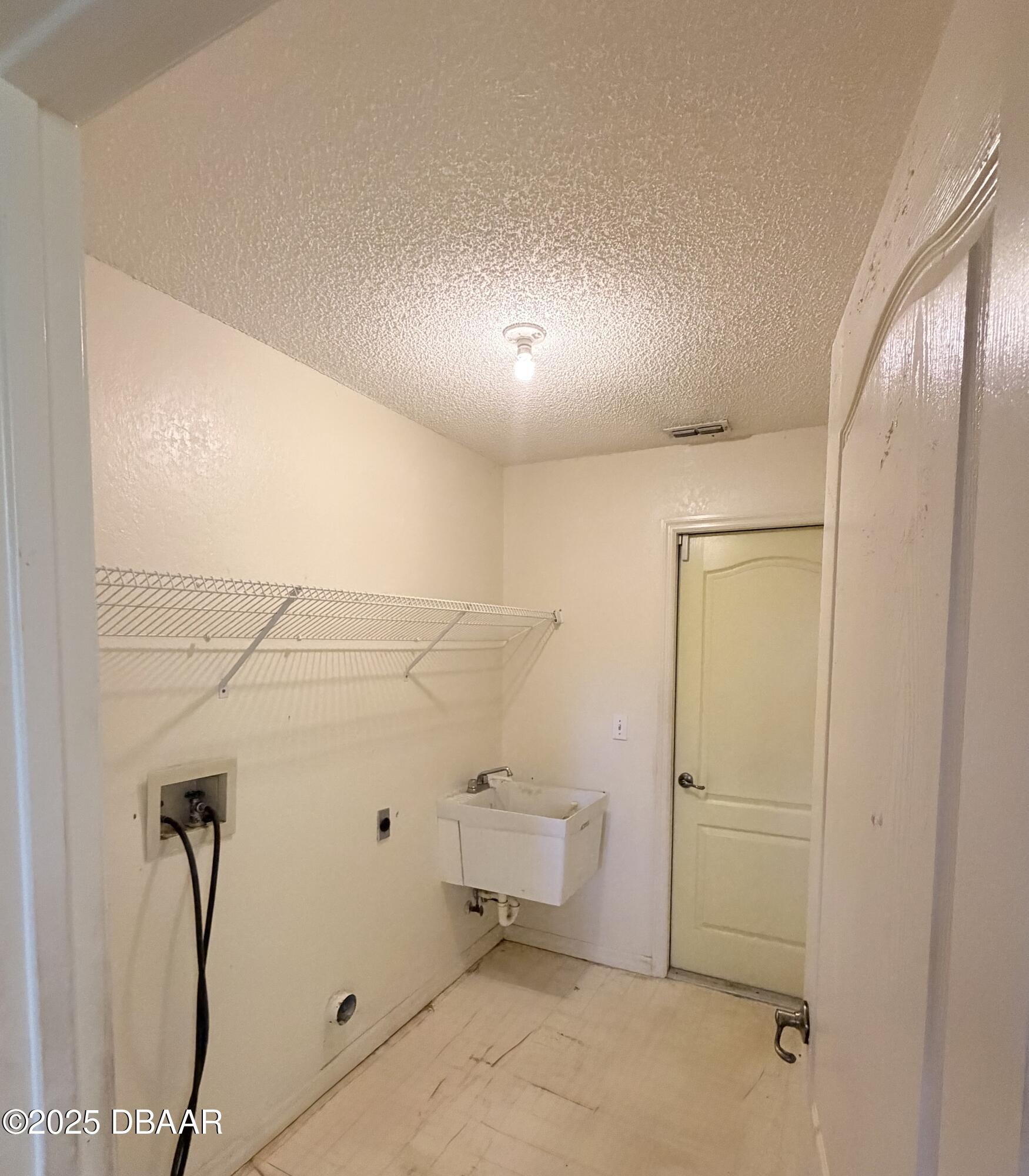 3108 Queen Palm Drive Edgewater, FL 32141 - Photo 8 of 10 Laundry Room