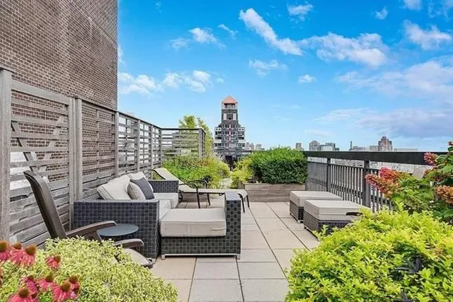 a view of a terrace with sitting area