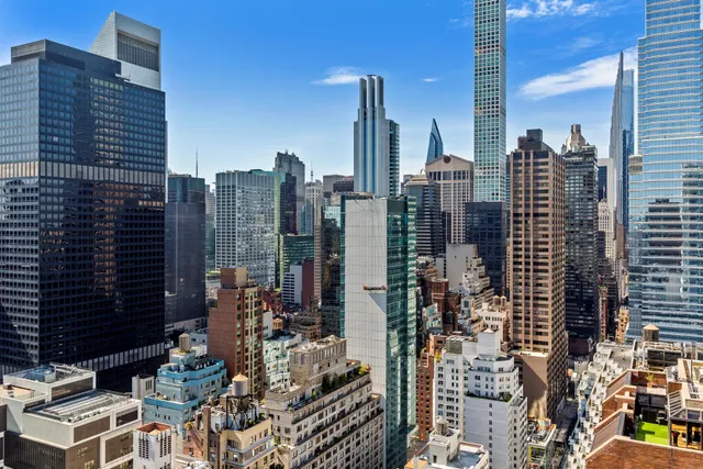 a view of city with tall buildings