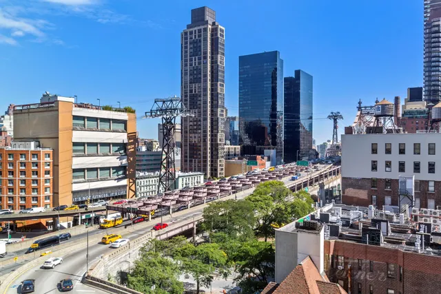 a city street filled with lots of tall buildings